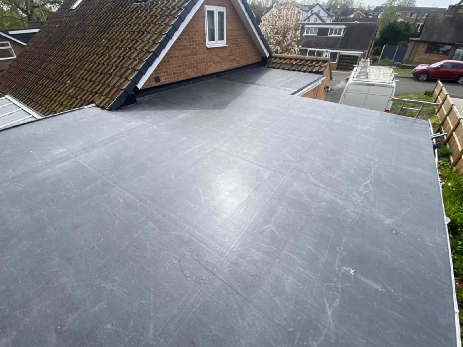 A new one-piece EPDM rubber flat roof on a garage